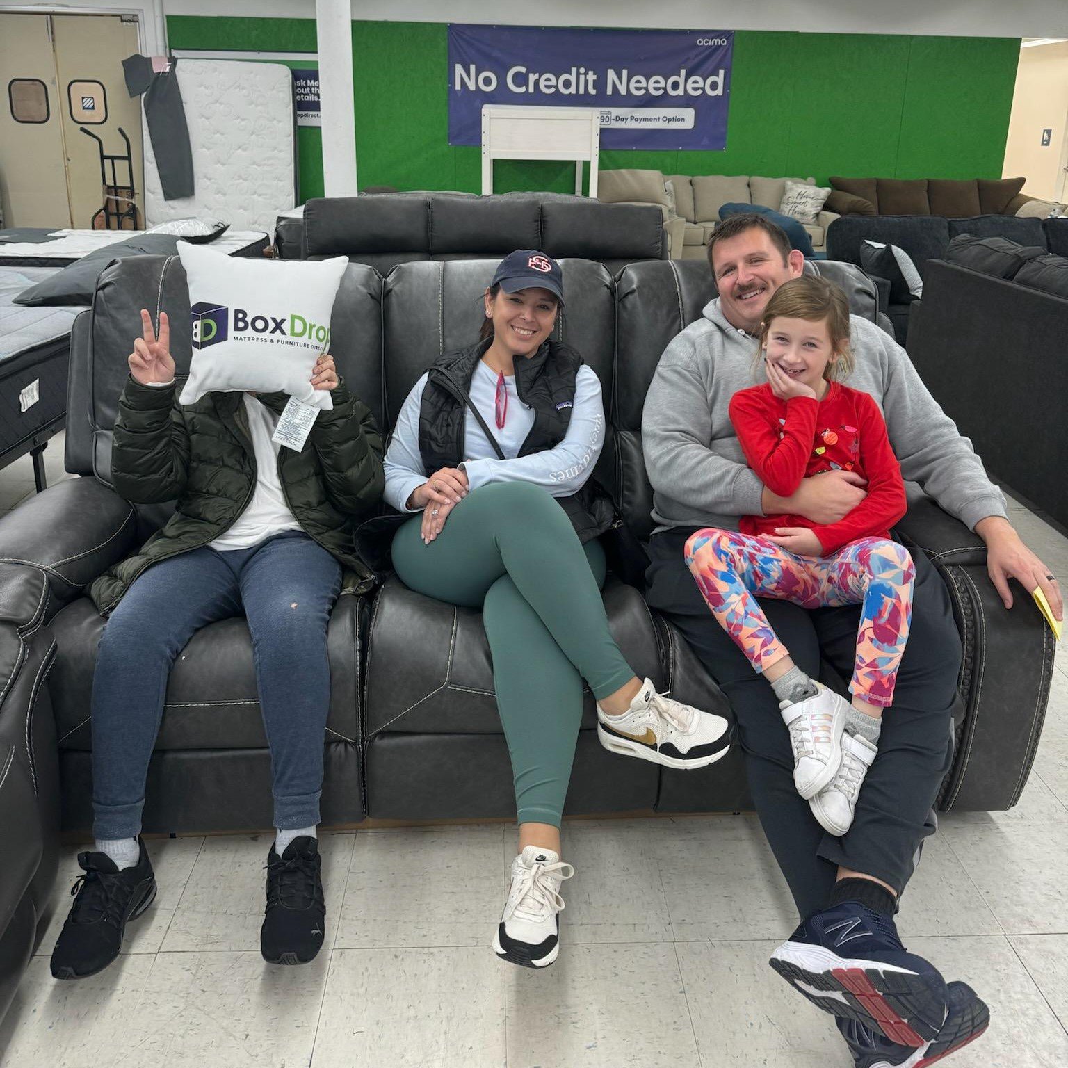 Family with new sofa from BoxDrop