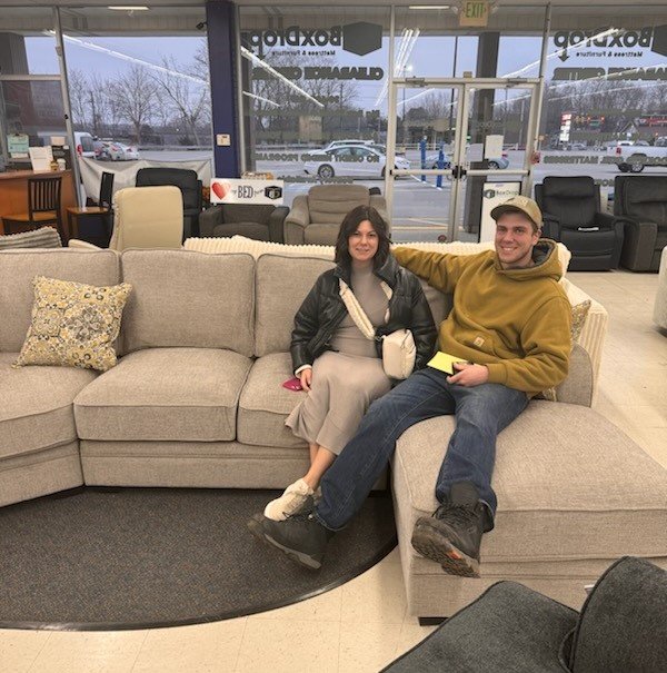 Couple with new light-colored couch