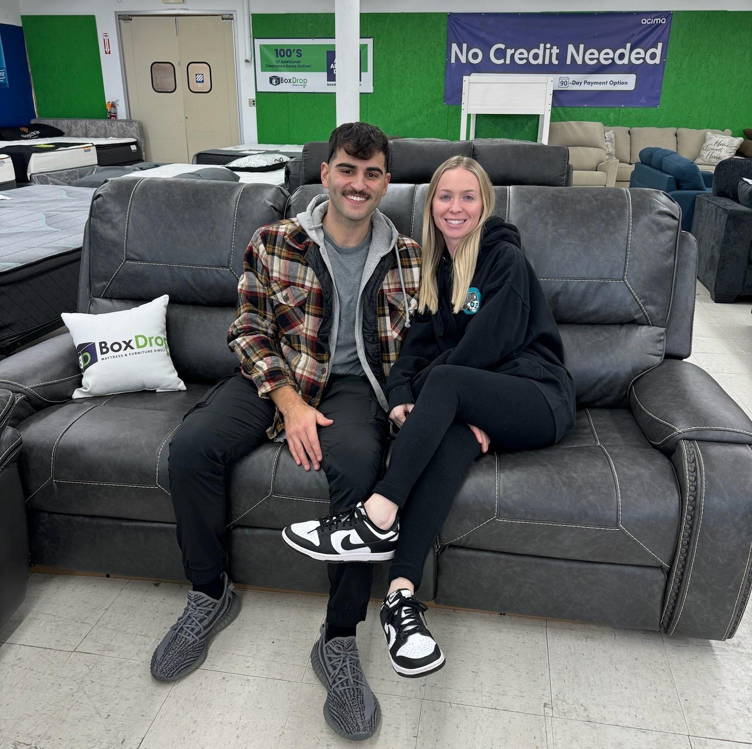 Couple with new sofa from BoxDrop